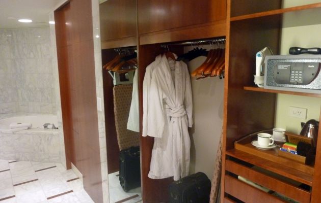 The attached walk-in closet, complete with bathrobes